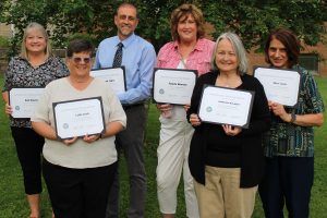 Retirees who attended the celebration are pictured. Front row from left: Cathy Irish and Katherine Korngiver. Back row from left: Beth Roberts, Woody Yoder, Pamela Whorton and Mary Curia.
