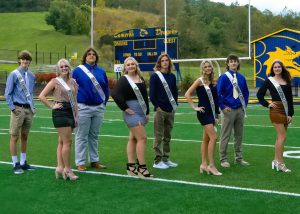 The King and Queen candidates are pictured from left: Shane Ball, Josie Cumpston, Gunnar Bryan, Annie Martin, Payton Neely, Aubre Cain-Loy, Mason DeBolt, and Audrey Bock. Photo credit: Jennifer Reynolds/Strike-A-Pose Photography
