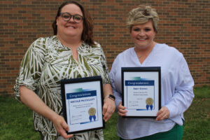 Pictured from left: MCS Service Personnel of the Year Nicole McCulley and MCS Teacher of the Year Abby Edman.