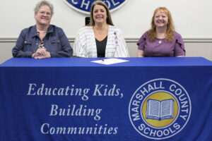 Pictured from left: ADK member Holly Woods, MCS Assistant Superintendent Karen Klamut and ADK member Jeannie Blake.