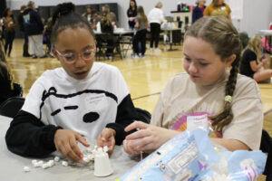 Students participate in hands-on activities at the Girl Powered STEM Workshop.